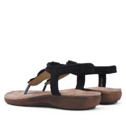 Sandalias planas Amarpies negras de dedo y cogidas al tobillo con detalles de madera
